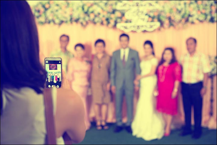 Guest-Taking-Photo-Of-Wedding-Party