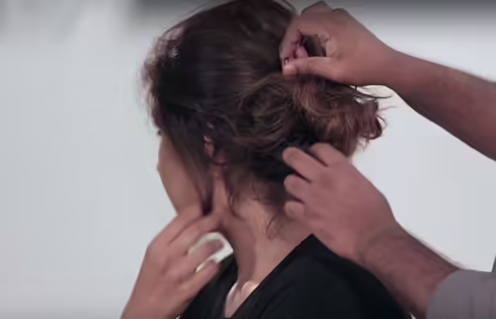 How To Do A Messy Bun - Step 10 Pull out flyaways to finish off the look