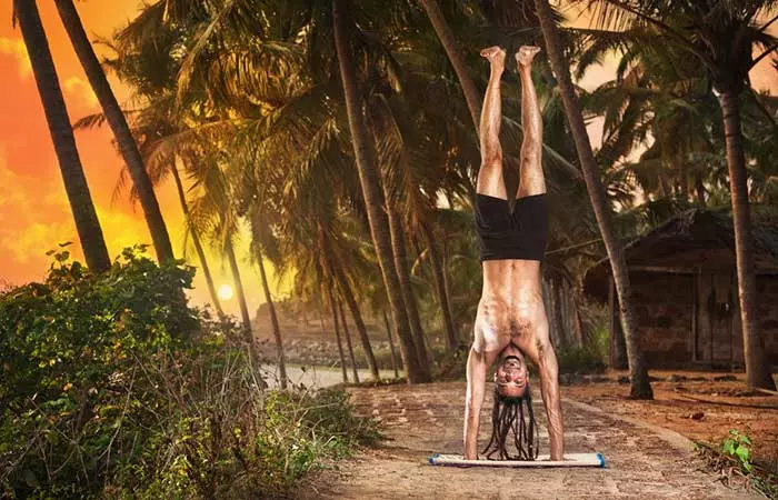 6. Adho Mukha Vrksasana (Tilted Tree Pose)