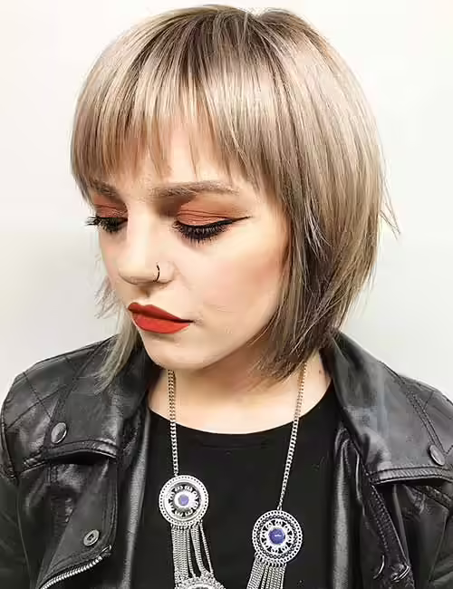 1. Razor Cut Layered Bob And Bangs
