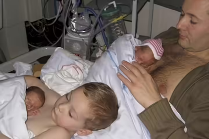 Young Boy Helping Dad Give Skin To Skin Contact To Premature Twins1