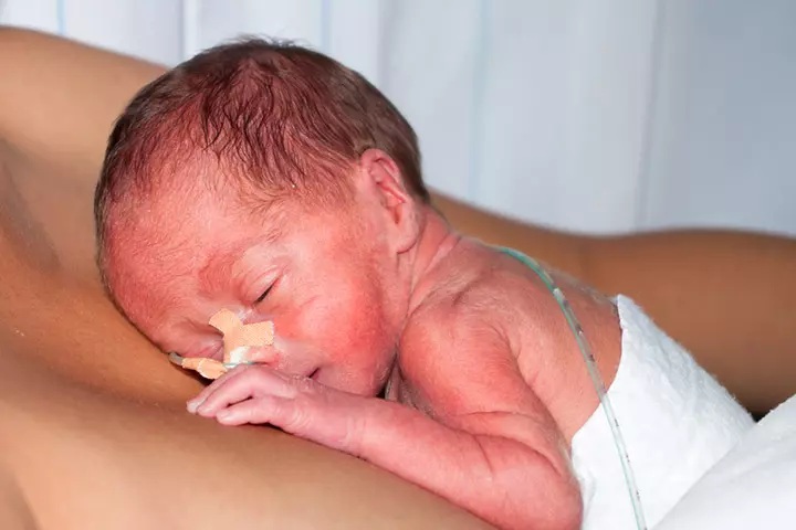 Young Boy Helping Dad Give Skin To Skin Contact To Premature Twins3