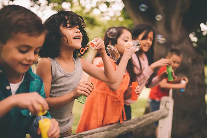 https://www.istockphoto.com/in/photo/little-boy-having-fun-with-friends-in-park-blowing-bubbles-gm517675430-89616245 