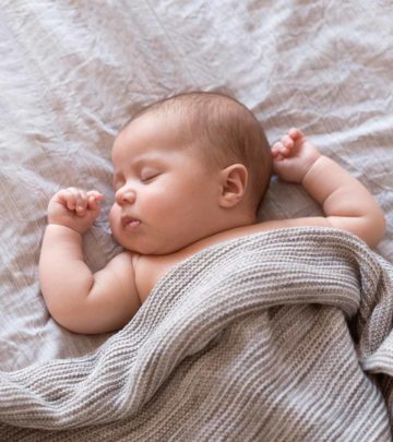 The exact age is unknown, but studies show REM and NREM sleep in the fetus after seven months.