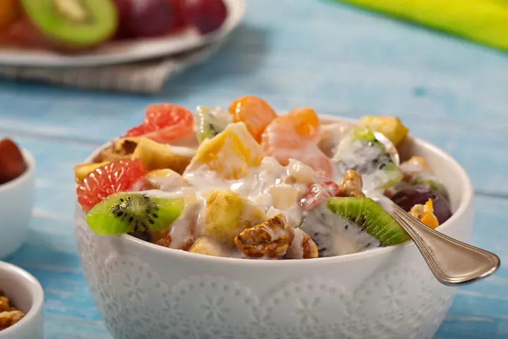 Fruit and nuts salad making with kids