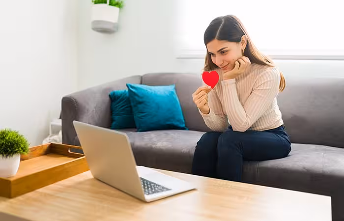 loving-girlfriend-is-showing-her-partner-a-love-heart-in-a-video-chat-