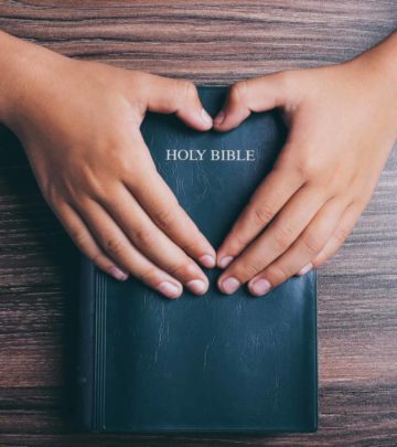 holy-bible-heart-shape-hands-on-1137646790