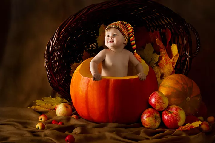 Autumn harvest themed baby in a pumpkin pictures