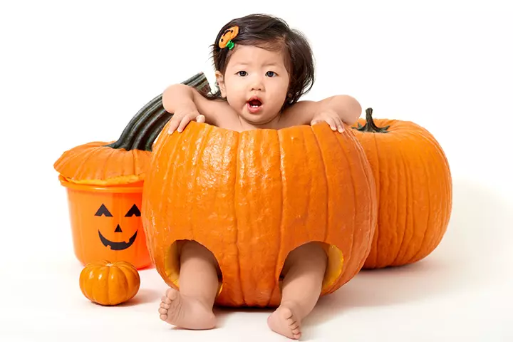 Cute hair accessory baby in a pumpkin pictures