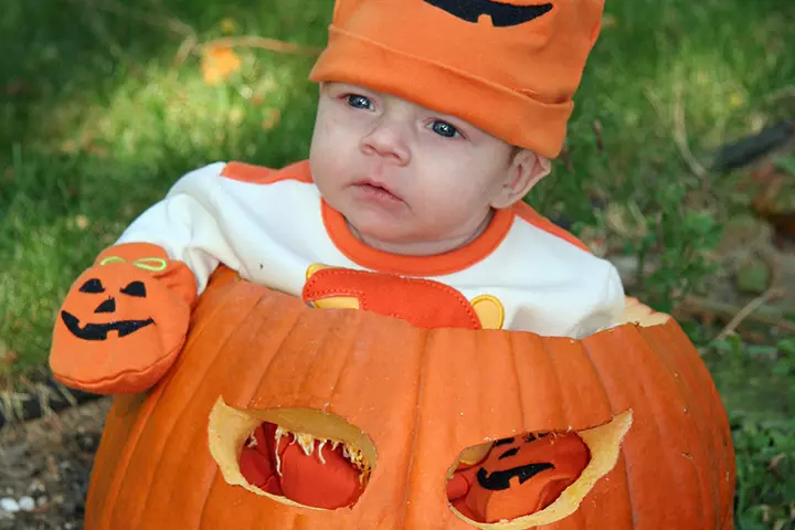 Sleepy baby in a pumpkin pictures