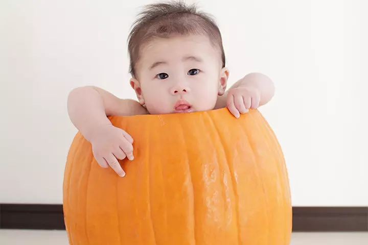 Small baby in a pumpkin pictures