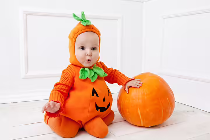 Spooky halloween themed baby in a pumpkin-pictures Spooky halloween themed baby in a pumpkin-pictures