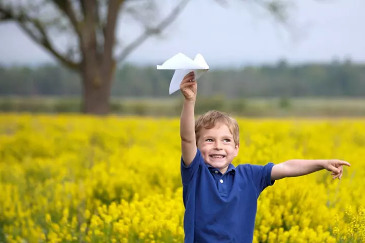 Flying paper airplanes, outdoor activities for babies