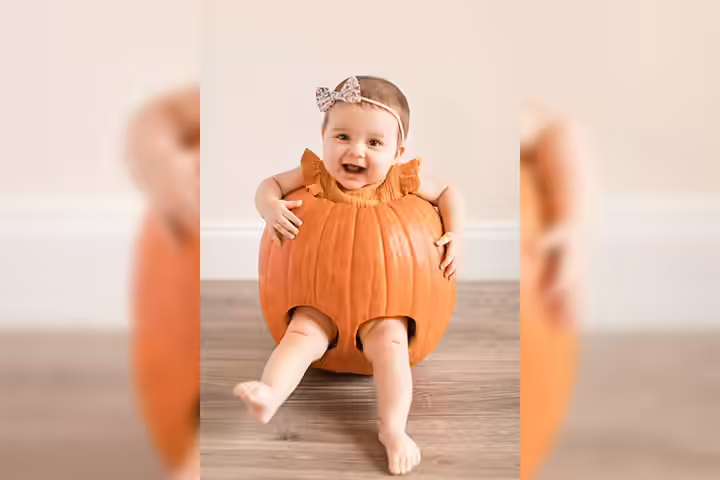 Bow wearing baby in a pumpkin pictures Bow wearing baby in a pumpkin pictures