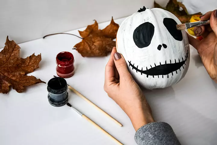 Jack Skellington-inspired pumpkin painting idea for kids