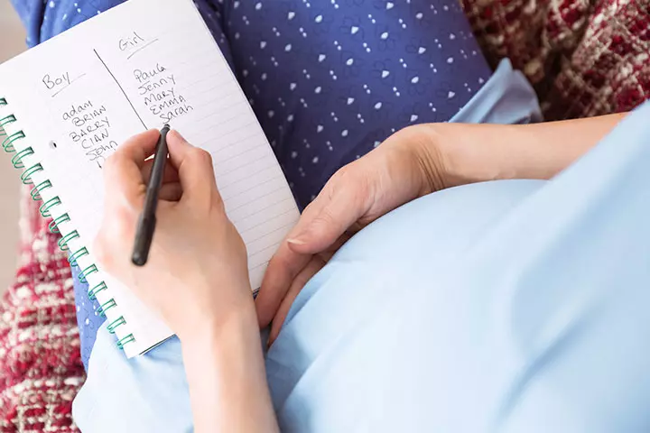 A pregnant woman listing out baby names