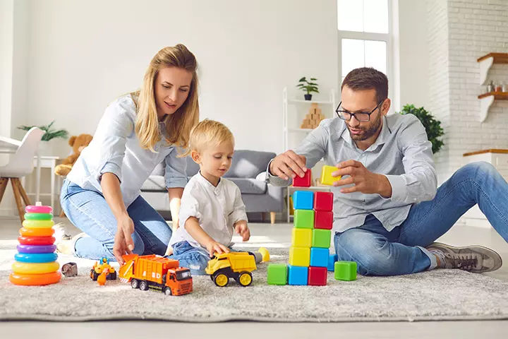 Parents playing with their child