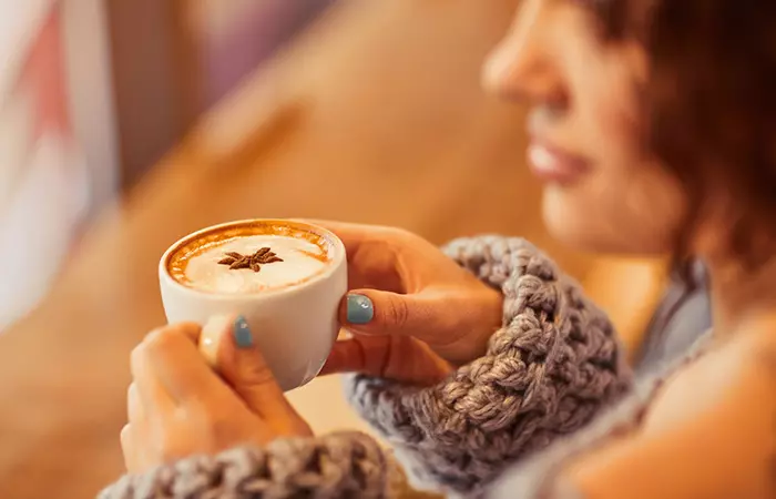 Woman drinking coffee instead of kratom tea