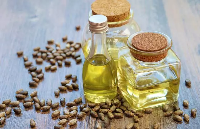 Castor oil with tea tree oil to enhance hair