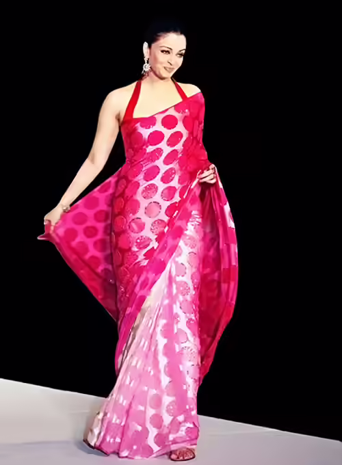 Aishwarya Rai in a glossy pink satin saree with halter neck blouse Aishwarya Rai in a glossy pink satin saree with halter neck blouse
