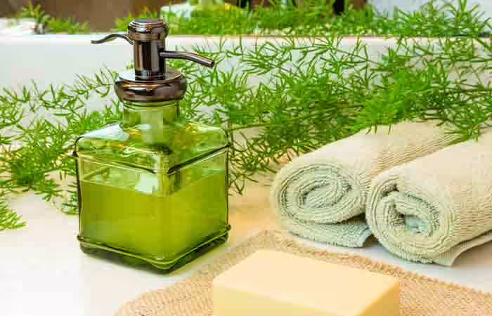 A bottle of liquid castile soap and a bar of natural soap