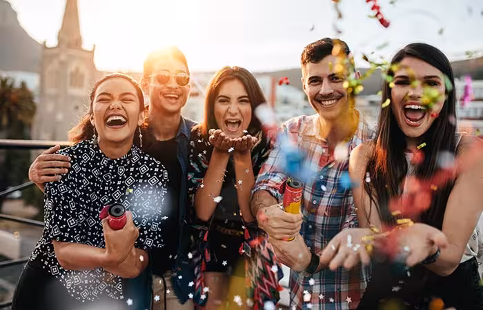 group-friends-enjoying-party-throwing-confetti