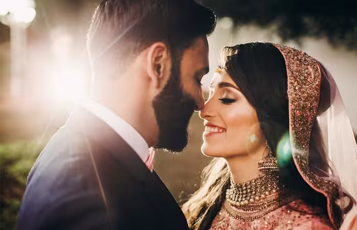 handsome-bearded-indian-groom-kisses-bride