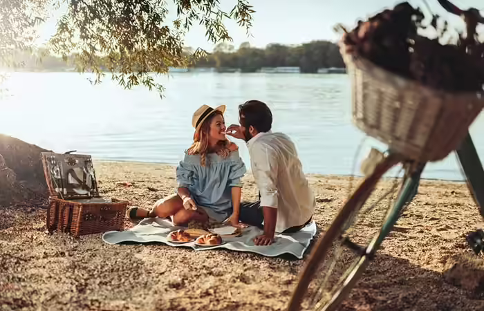 Couple enjoying a picnic together Couple enjoying a picnic together