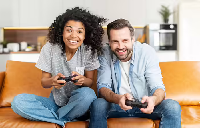 Couple playing video game together Couple playing video game together