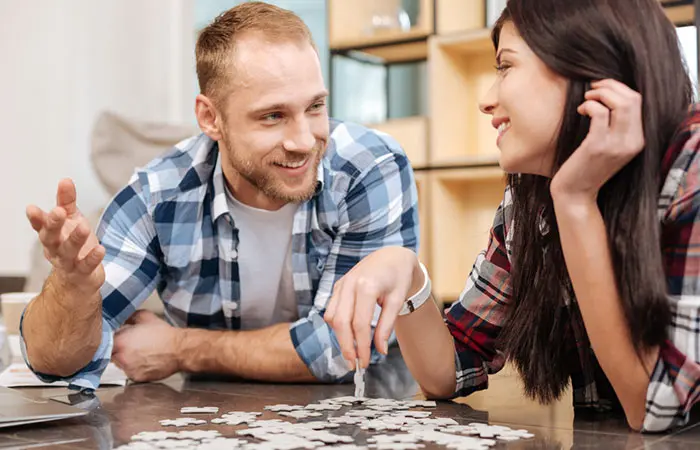 Couple working on a jigsaw puzzle