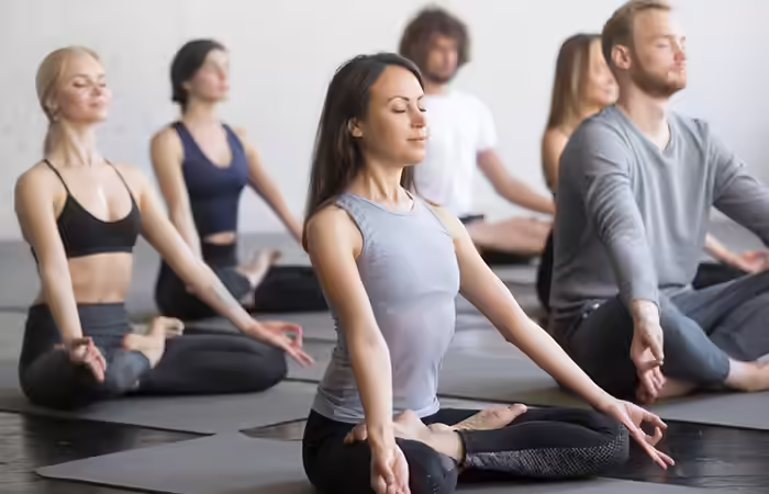 Couple taking a meditaion class Couple taking a meditaion class