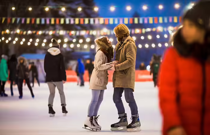 Couple ice skating romantically Couple ice skating romantically