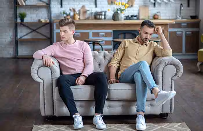 Upset couple falling out of love and sitting apart