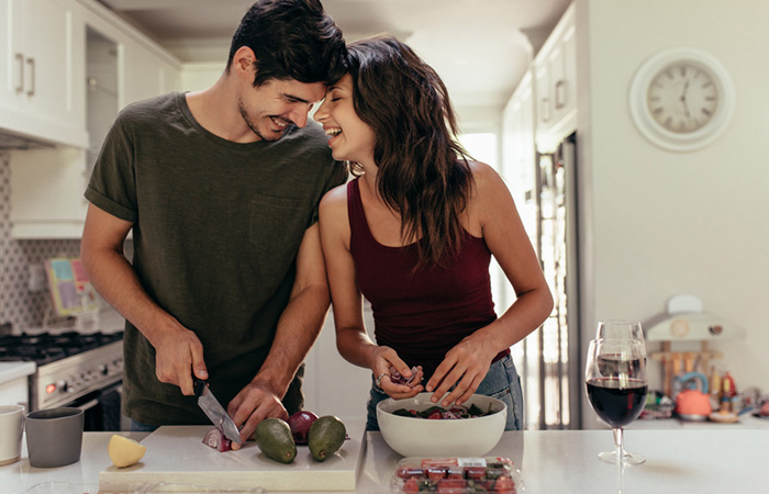 A couple cooking together to spice up the relationship