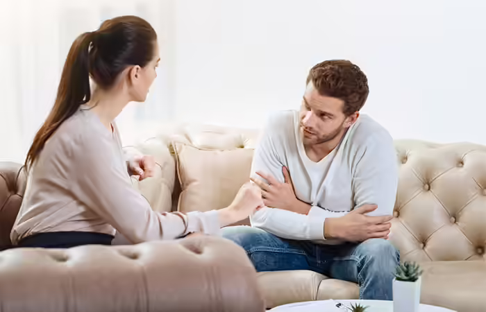 A couple having a conversation to resolve issues related to anxious attachment style.