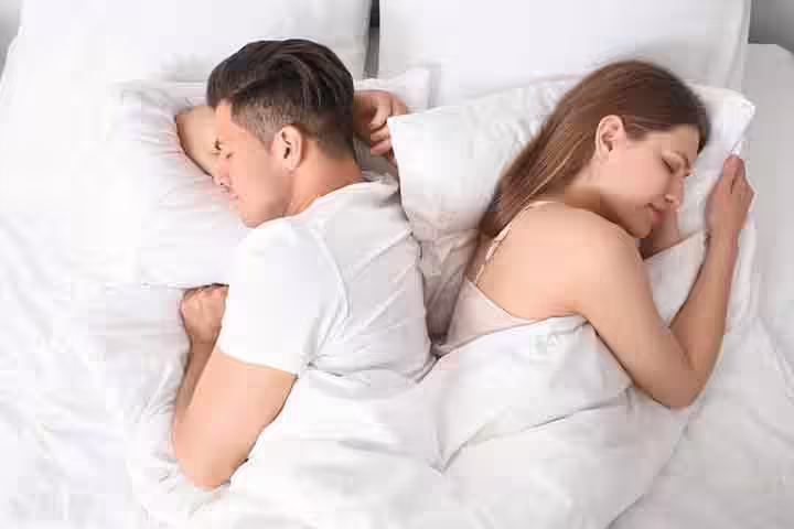 This is one of the most affectionate and cozy sleeping positions for a couple. In this position, the couple coils their arms and legs around each other, indicating they don’t want to get separated. Partners sleeping in this position are known to have intense emotions to share. Also, the position shows that the couple is highly dependent on one another. However, the indications might differ from one couple to another.