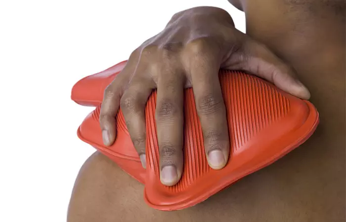 Woman giving hot water compress to a boil