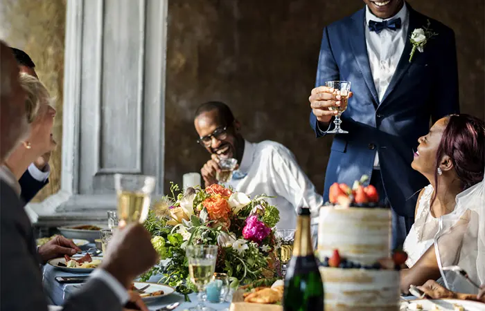 The best man is asking his buddies for their opinions on the speech.