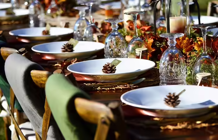 Fall-themed wedding tables decorated with autumnal accents