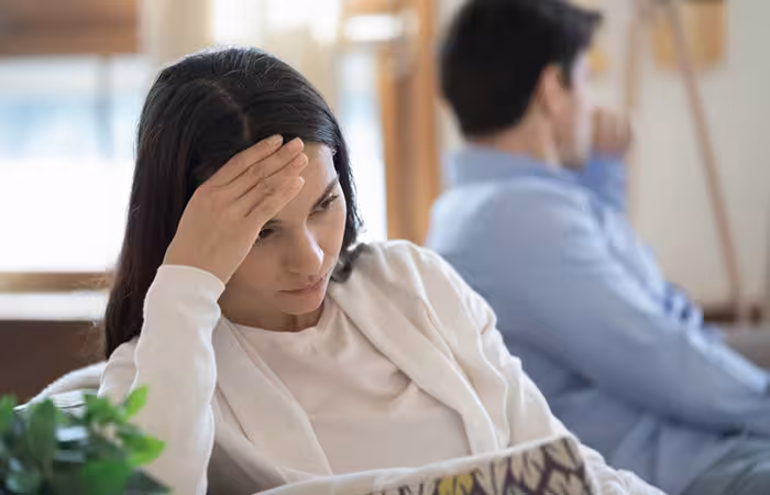 A disappointed woman sitting after fighting with her partner.