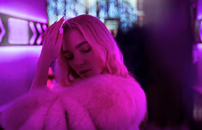 A girl with a glow in the night background at a teen birthday party