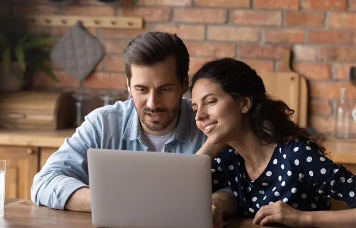 Couple discussing about wedding budget plan.