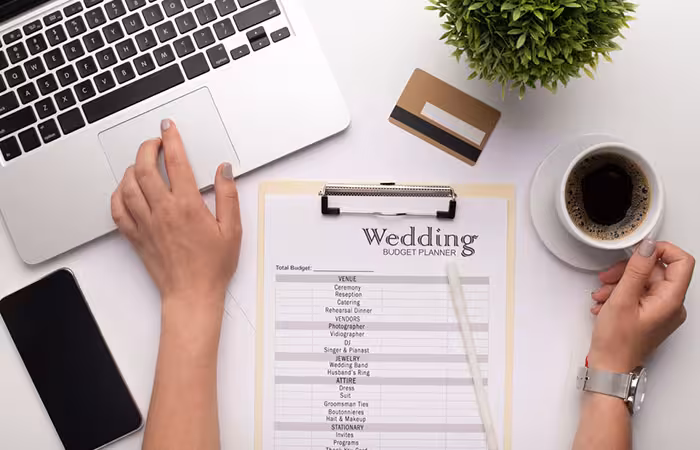 Woman preparing wedding budget plan.