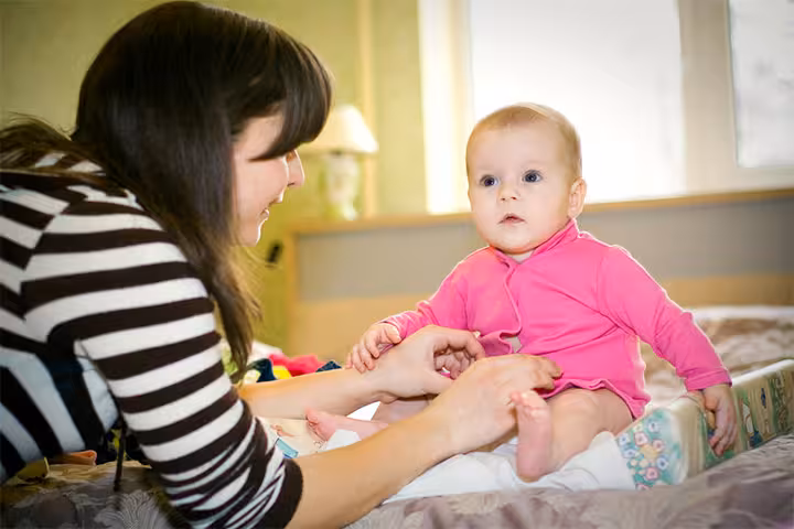 How to calm baby while dressing