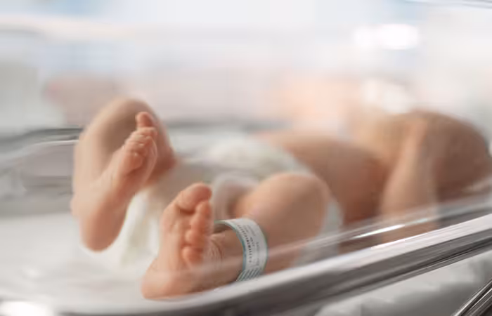 Newborn baby with a name tag