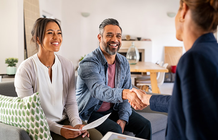 Woman inviting opposite sex unmarried couple to wedding