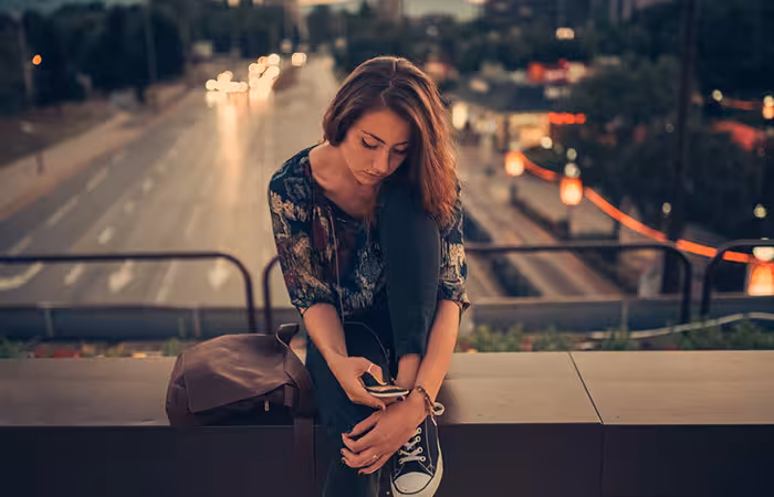 Lonely woman texting her ex