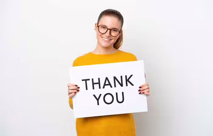 Woman holding a thank you card