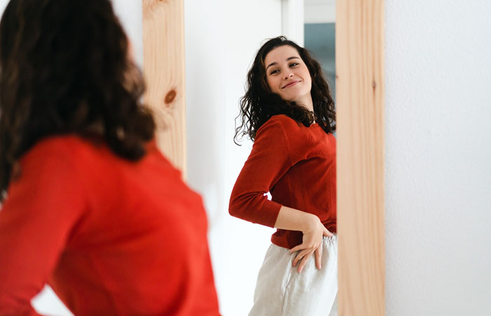 Woman looking at her body