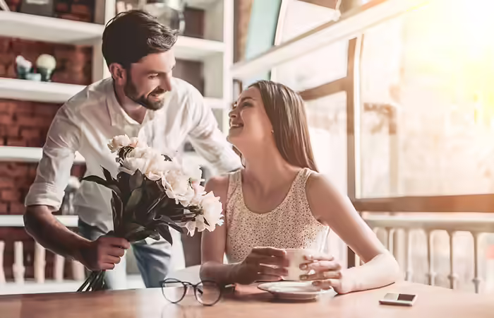 Man giving a bouquet to girlfriend